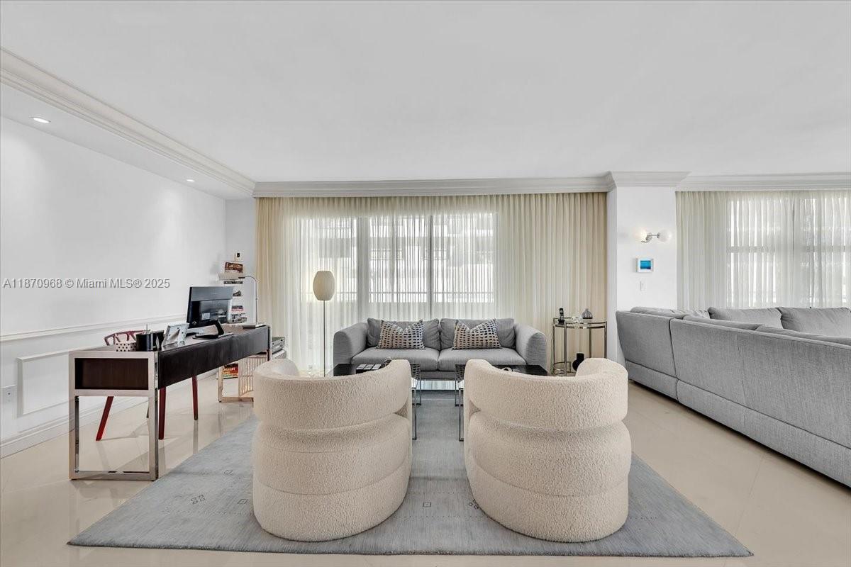 9801 Collins Avenue, Unit 4Y Bal Harbour, FL 33154 - Photo 21 of 71 a living room with furniture and a large window