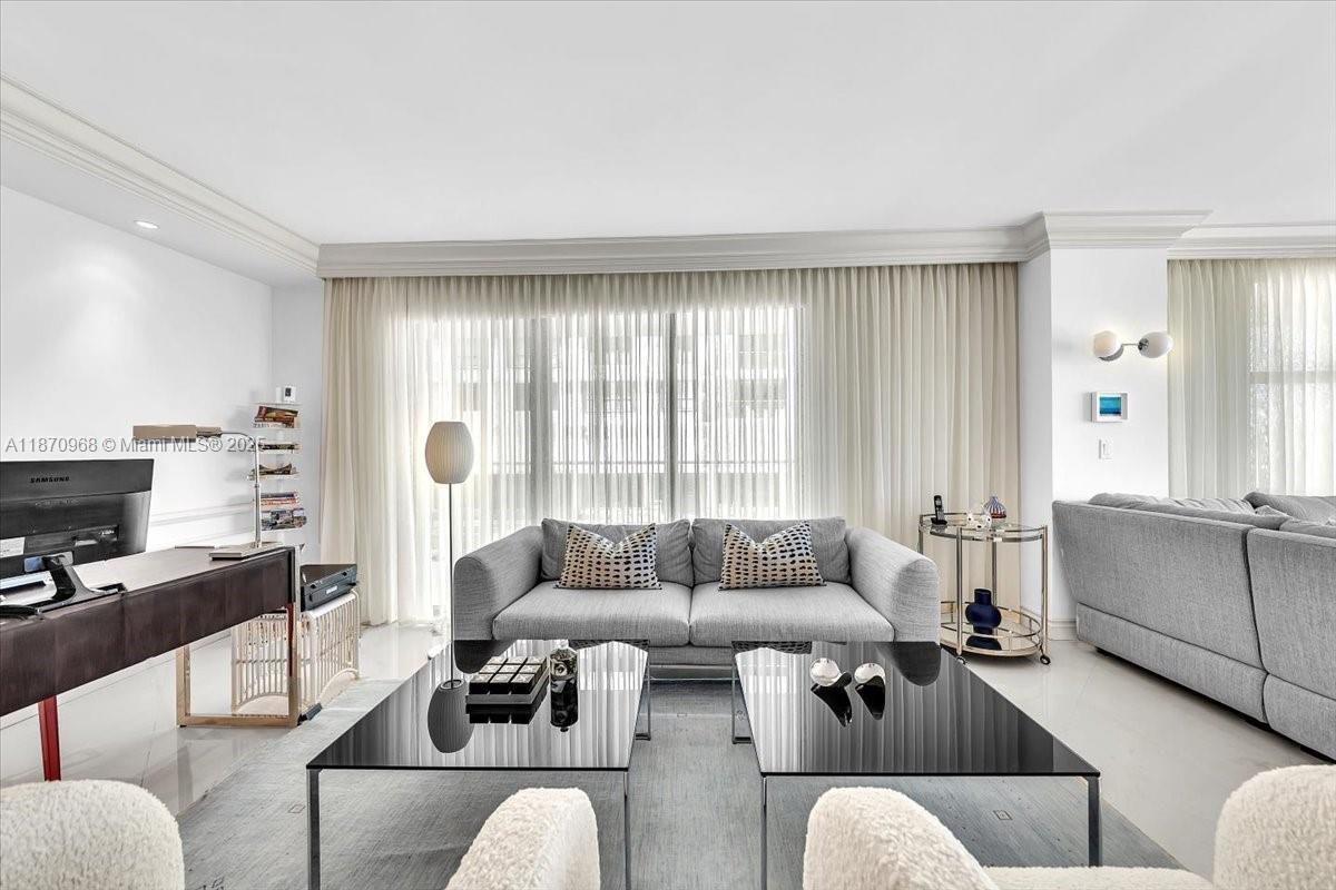 9801 Collins Avenue, Unit 4Y Bal Harbour, FL 33154 - Photo 22 of 71 a living room with furniture and a large window