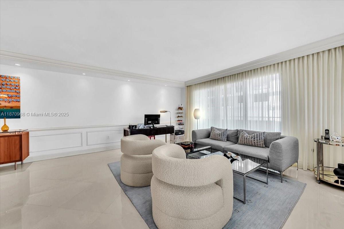 9801 Collins Avenue, Unit 4Y Bal Harbour, FL 33154 - Photo 23 of 71 a living room with furniture and a large window