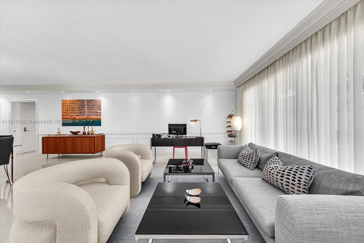 9801 Collins Avenue, Unit 4Y Bal Harbour, FL 33154 - Photo 24 of 71 a living room with furniture a rug and a window