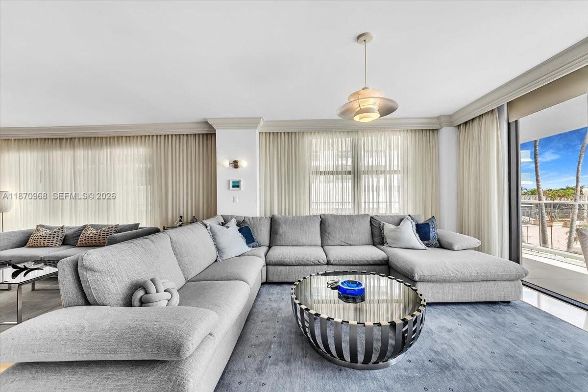 9801 Collins Avenue, Unit 4Y Bal Harbour, FL 33154 - Photo 26 of 72 a living room with furniture and a large window