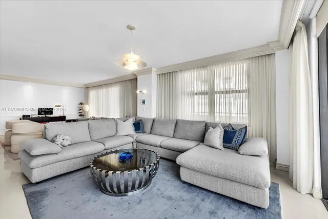 a bedroom with furniture and a flat screen tv