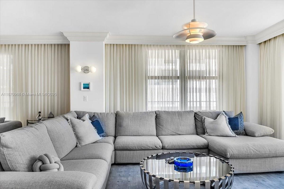 9801 Collins Avenue, Unit 4Y Bal Harbour, FL 33154 - Photo 30 of 71 a living room with furniture and a large window