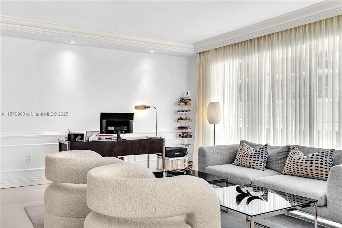 9801 Collins Avenue, Unit 4Y Bal Harbour, FL 33154 - Photo 34 of 71 a living room with furniture and a large window