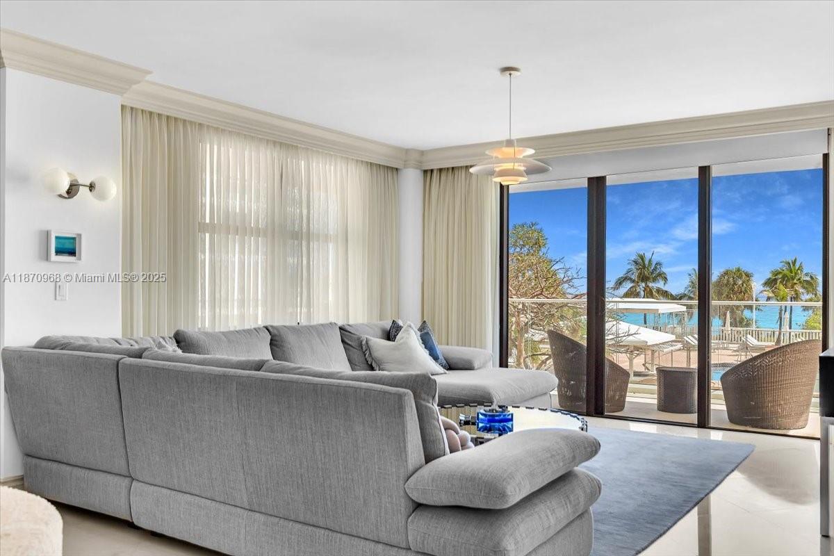 9801 Collins Avenue, Unit 4Y Bal Harbour, FL 33154 - Photo 35 of 71 a living room with furniture and a large window