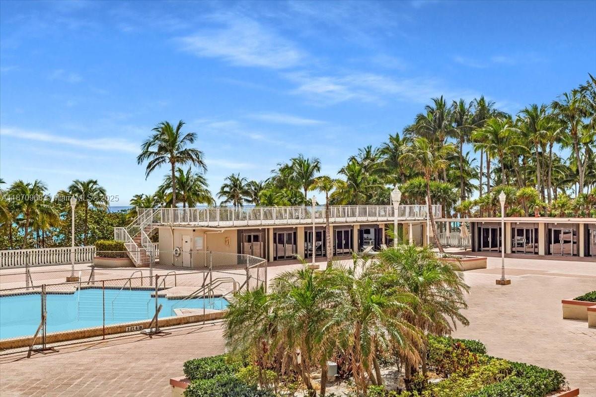 9801 Collins Avenue, Unit 4Y Bal Harbour, FL 33154 - Photo 39 of 71 a view of a house with a yard