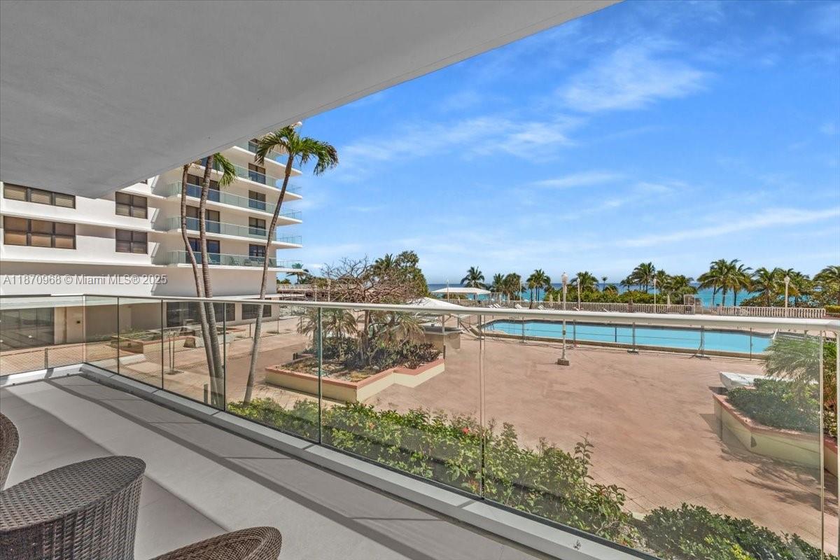 9801 Collins Avenue, Unit 4Y Bal Harbour, FL 33154 - Photo 41 of 71 a view of a lake from a balcony