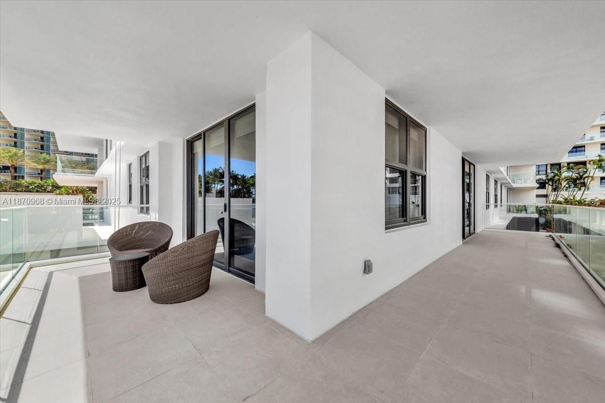 9801 Collins Avenue, Unit 4Y Bal Harbour, FL 33154 - Photo 43 of 71 a view of a livingroom with furniture and window