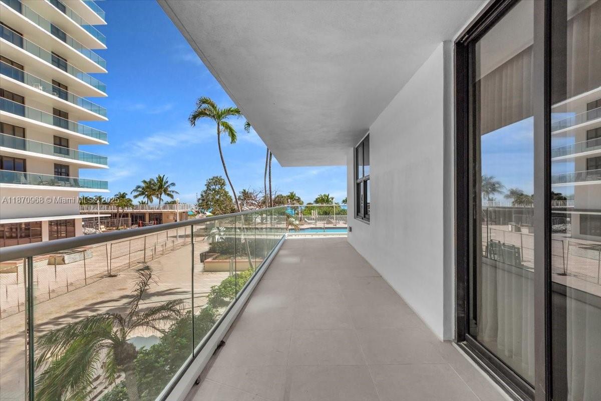 9801 Collins Avenue, Unit 4Y Bal Harbour, FL 33154 - Photo 44 of 71 a view of balcony with two potted plants