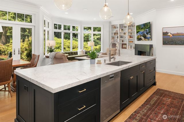 a kitchen with a sink a counter top space and a window