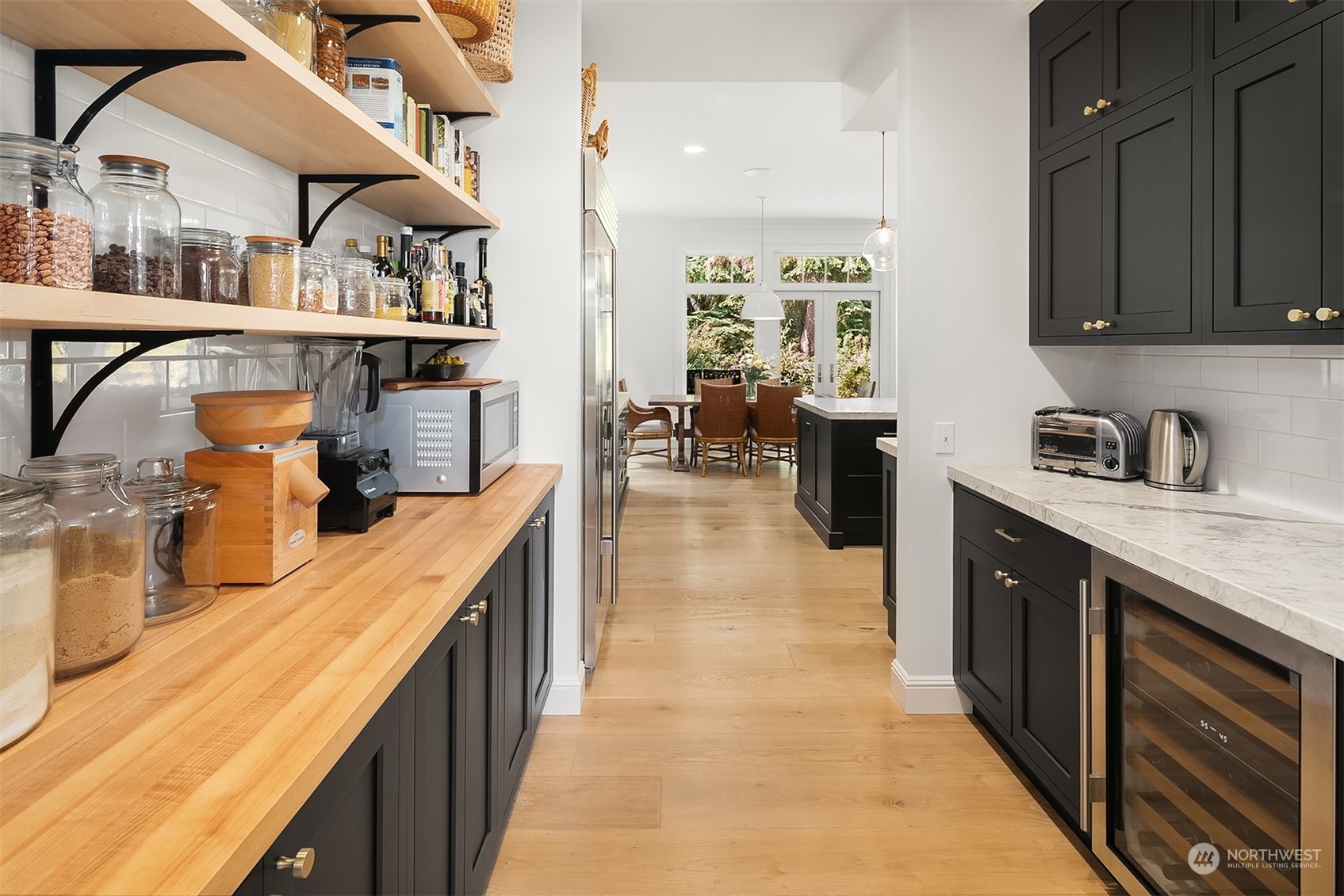 16030 Southeast 48th Drive Bellevue, WA 98006 - Photo 16 of 35 a kitchen with stainless steel appliances granite countertop a sink and cabinets