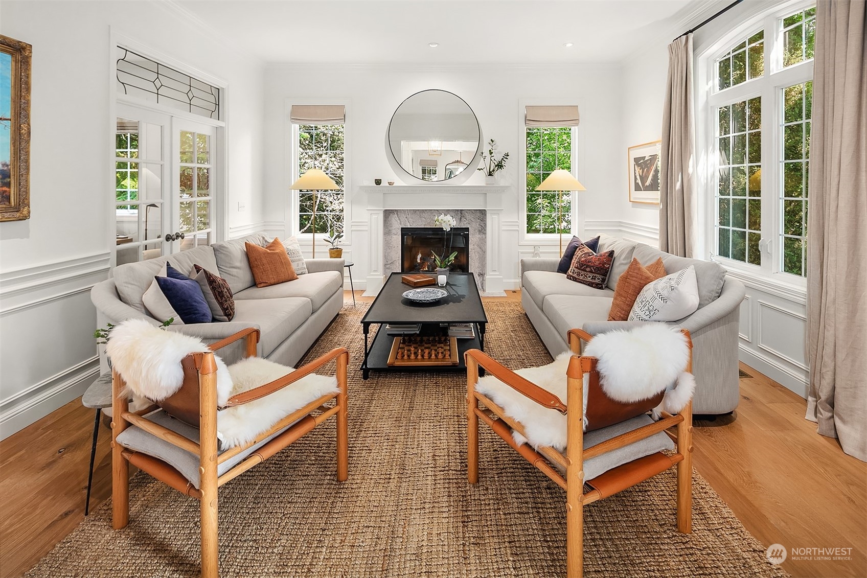 16030 Southeast 48th Drive Bellevue, WA 98006 - Photo 2 of 35 a living room with furniture a large window and a fireplace