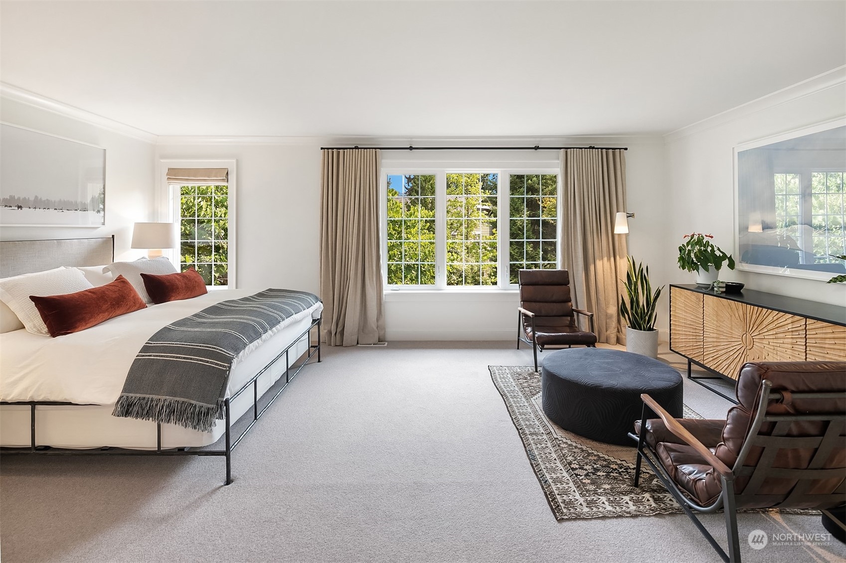 16030 Southeast 48th Drive Bellevue, WA 98006 - Photo 22 of 35 a spacious bedroom with a bed and glass window