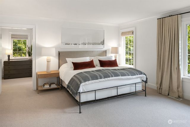 a bedroom with a bed and window