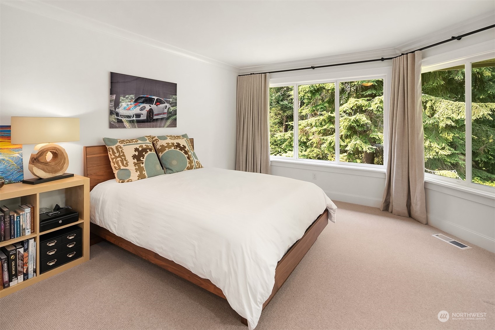 16030 Southeast 48th Drive Bellevue, WA 98006 - Photo 32 of 35 a bed sitting in a bedroom next to a window