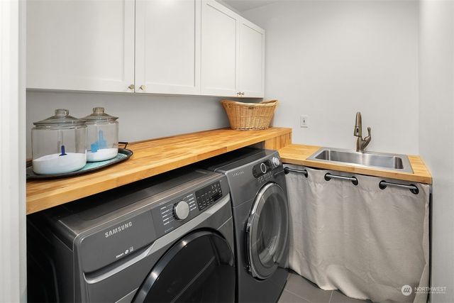 a view of cabinets and washer dryer