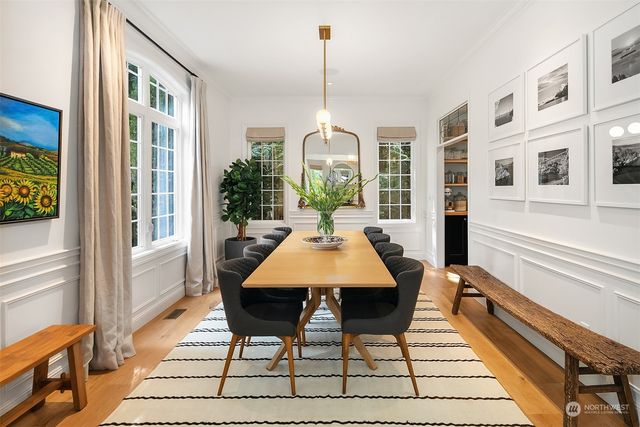 a dining room with a table and chairs