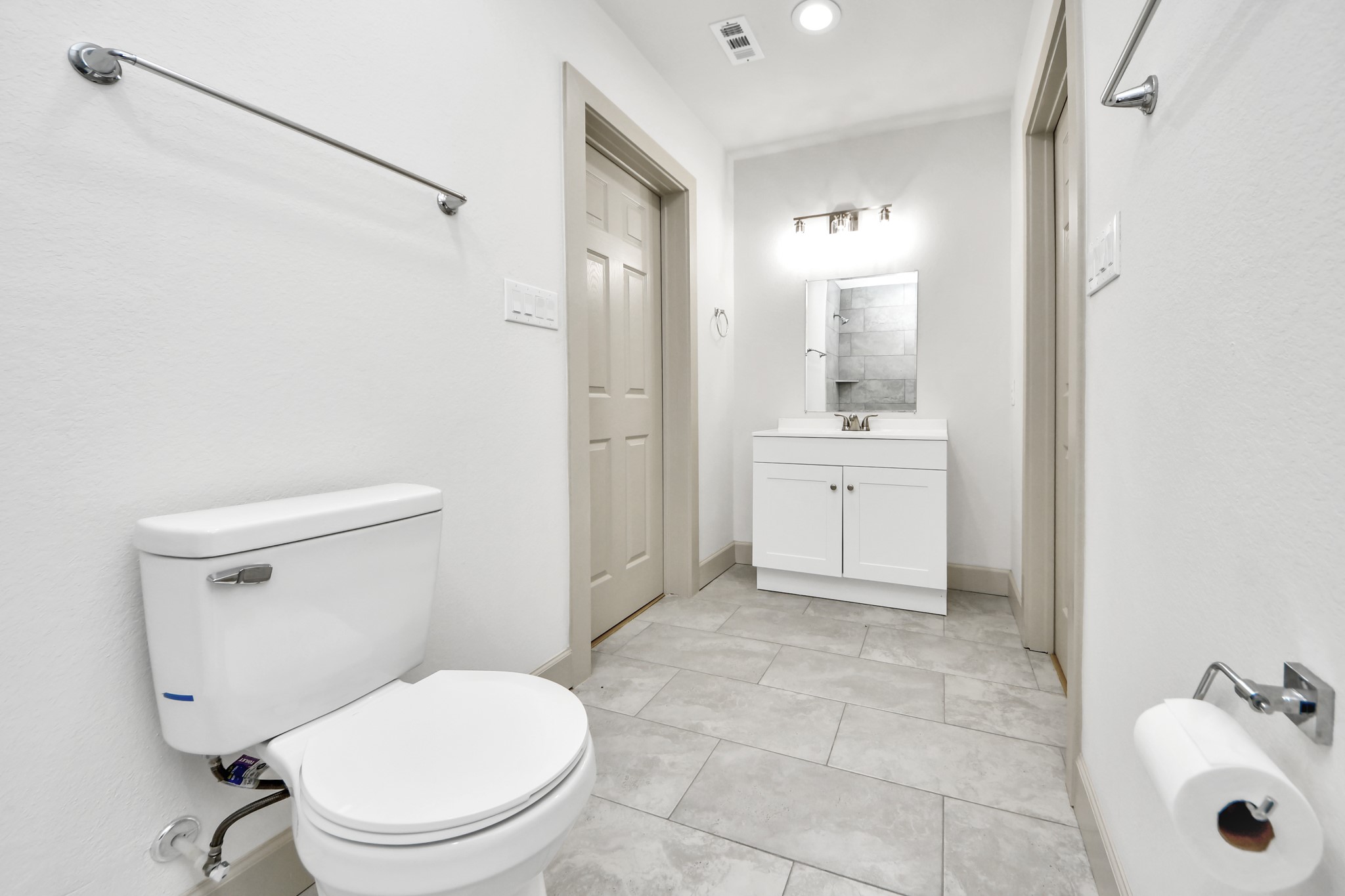 2919 Rosedale Street, Unit B Houston, TX 77004 - Photo 21 of 35 a bathroom with a sink a toilet and shower
