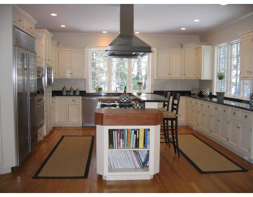 1080 North Street Walpole, MA 02081 - Photo 2 of 20 a kitchen with stainless steel appliances granite countertop a stove a sink and a refrigerator