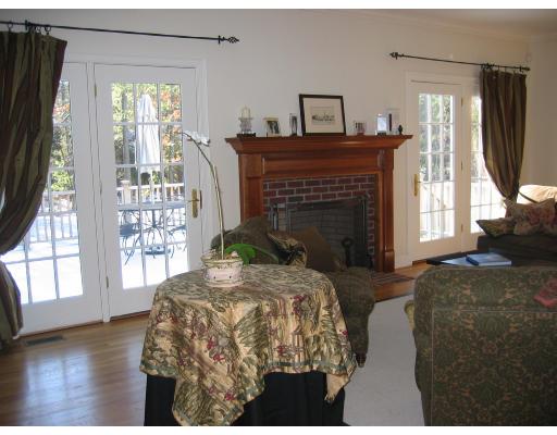 1080 North Street Walpole, MA 02081 - Photo 6 of 20 a living room with furniture and a fireplace