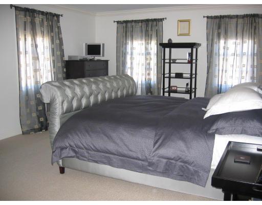 1080 North Street Walpole, MA 02081 - Photo 10 of 20 a bedroom with a bed and window