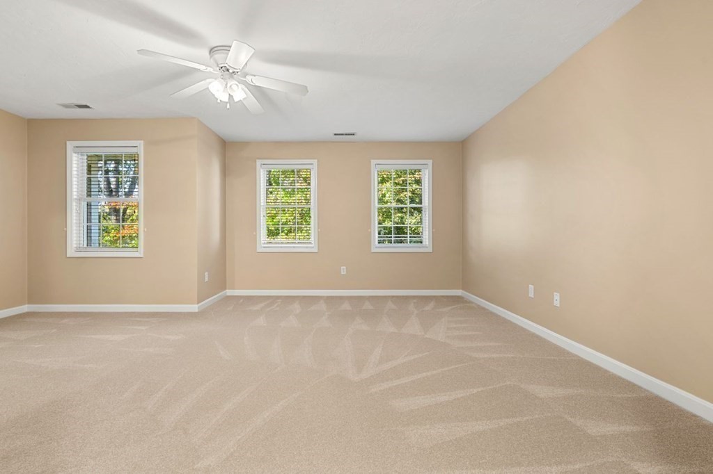 21 Conover Way, Unit 21 Haverhill, MA 01835 - Photo 11 of 31 an empty room with windows and fan