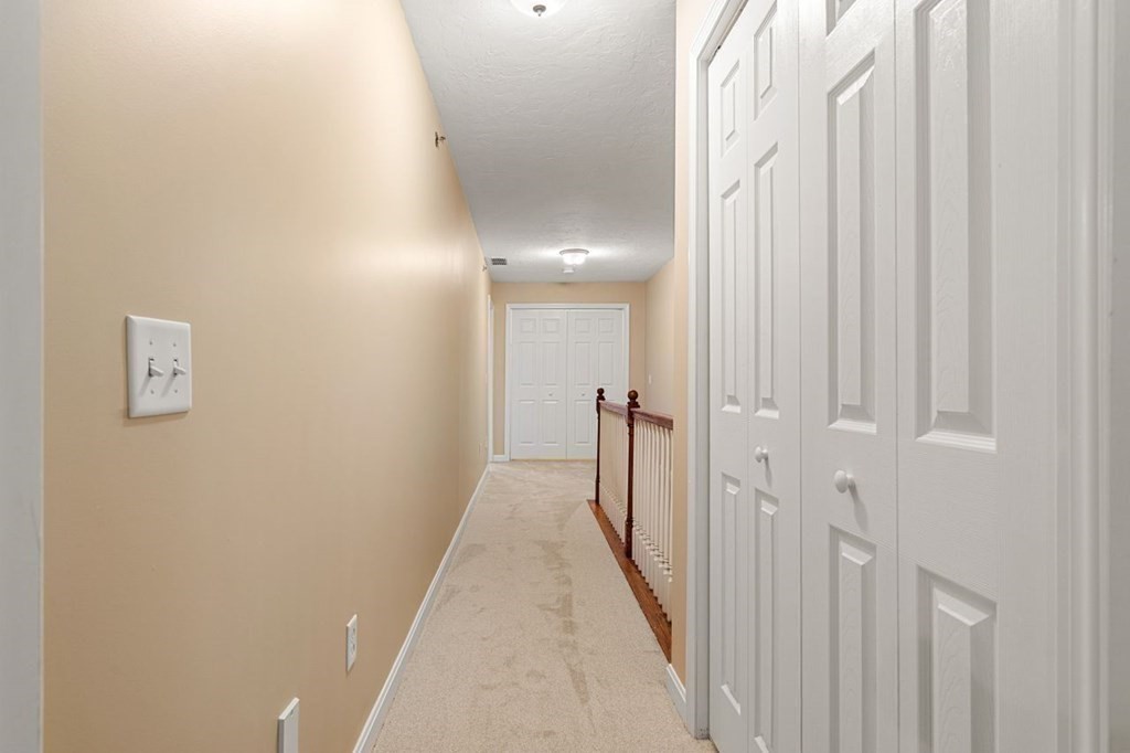 21 Conover Way, Unit 21 Haverhill, MA 01835 - Photo 17 of 31 a view of a hallway with a white walls