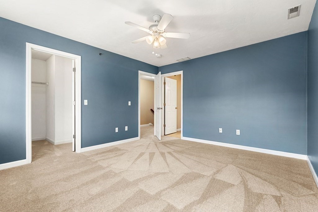 21 Conover Way, Unit 21 Haverhill, MA 01835 - Photo 22 of 31 a view of a livingroom with a chandelier fan and windows