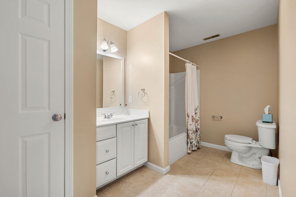 21 Conover Way, Unit 21 Haverhill, MA 01835 - Photo 25 of 31 a bathroom with a toilet sink and mirror
