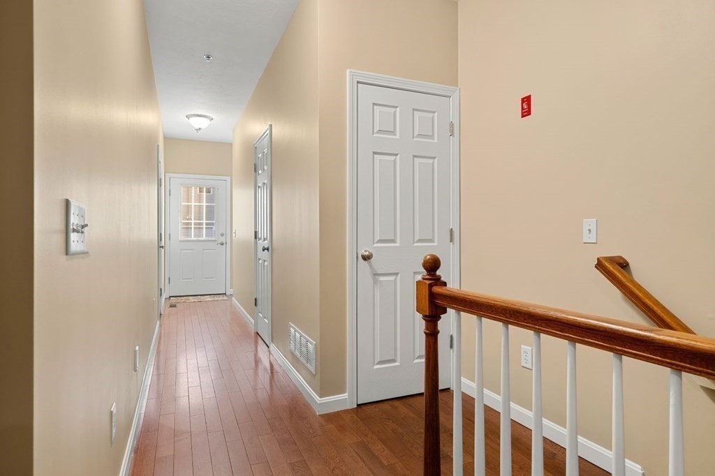 21 Conover Way, Unit 21 Haverhill, MA 01835 - Photo 26 of 31 a view of a hallway with wooden floor