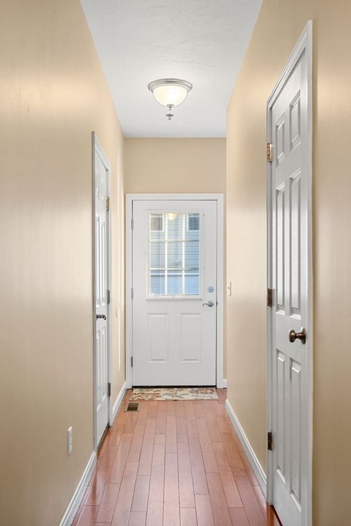 21 Conover Way, Unit 21 Haverhill, MA 01835 - Photo 29 of 31 wooden floor in an empty room with a window