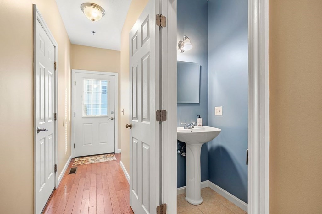 21 Conover Way, Unit 21 Haverhill, MA 01835 - Photo 10 of 31 a bathroom with a sink and a mirror