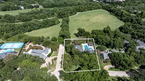 an aerial view of houses with yard