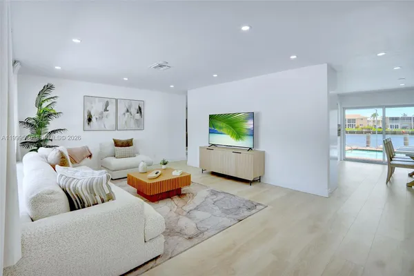 a living room with furniture and a large window