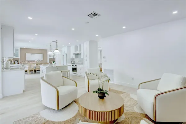 a kitchen with sink cabinets and window