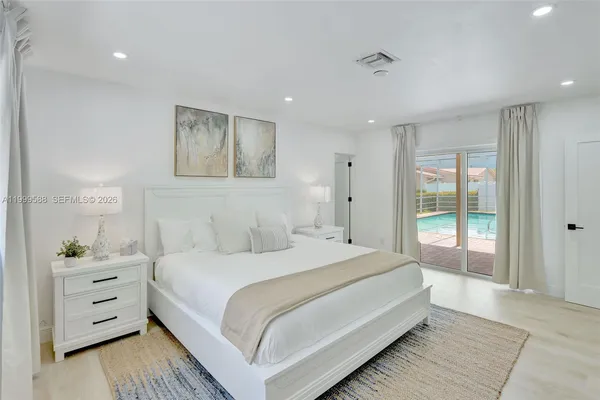 a bathroom with a shower sink and a bathtub