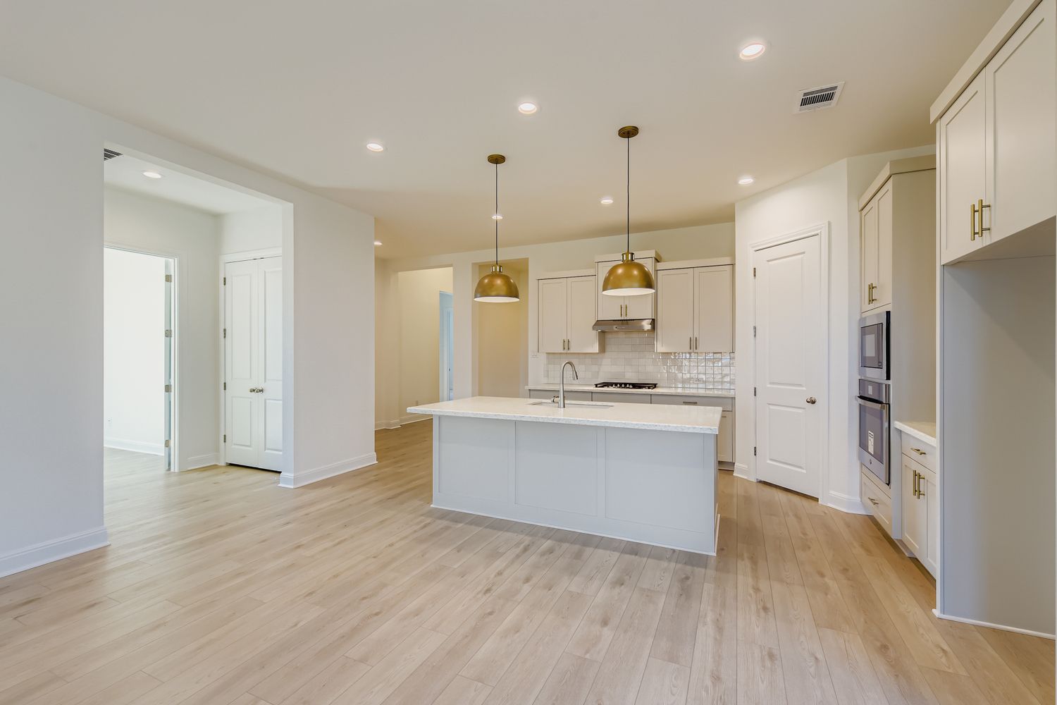 395 Prickly Poppy Loop Kyle, TX 78640 - Photo 4 of 11 a view of kitchen with stainless steel appliances refrigerator stove microwave and cabinets