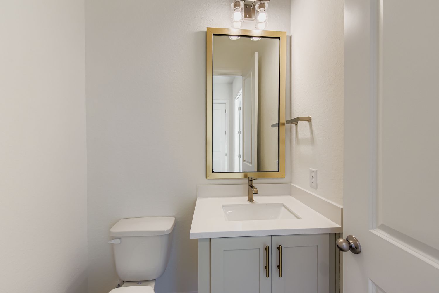 395 Prickly Poppy Loop Kyle, TX 78640 - Photo 5 of 11 a bathroom with a toilet sink and mirror