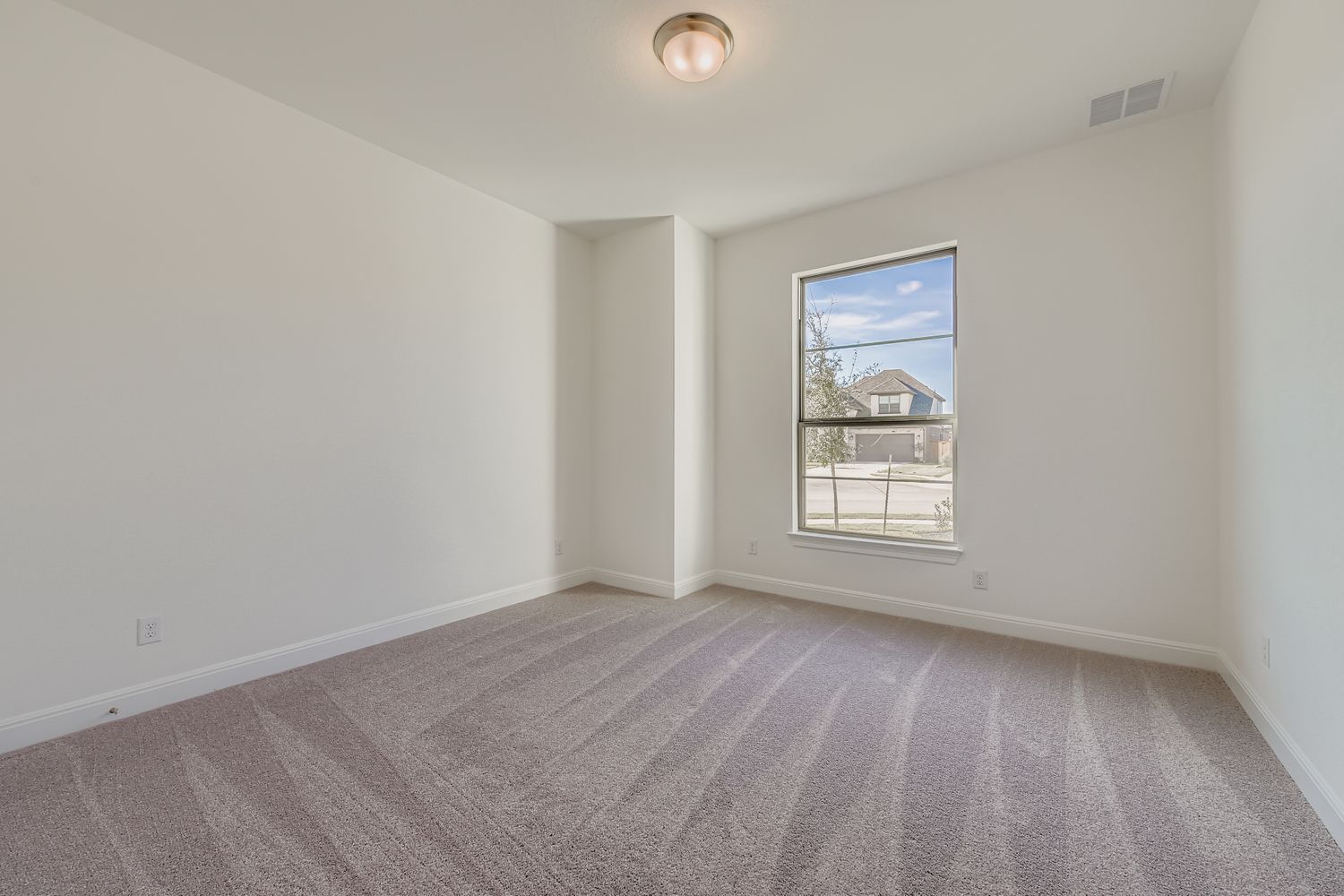 395 Prickly Poppy Loop Kyle, TX 78640 - Photo 9 of 11 an empty room with a window