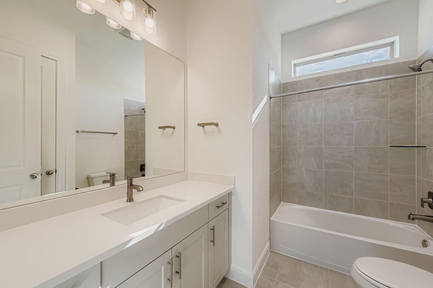 395 Prickly Poppy Loop Kyle, TX 78640 - Photo 10 of 11 a bathroom with a granite countertop sink toilet and shower