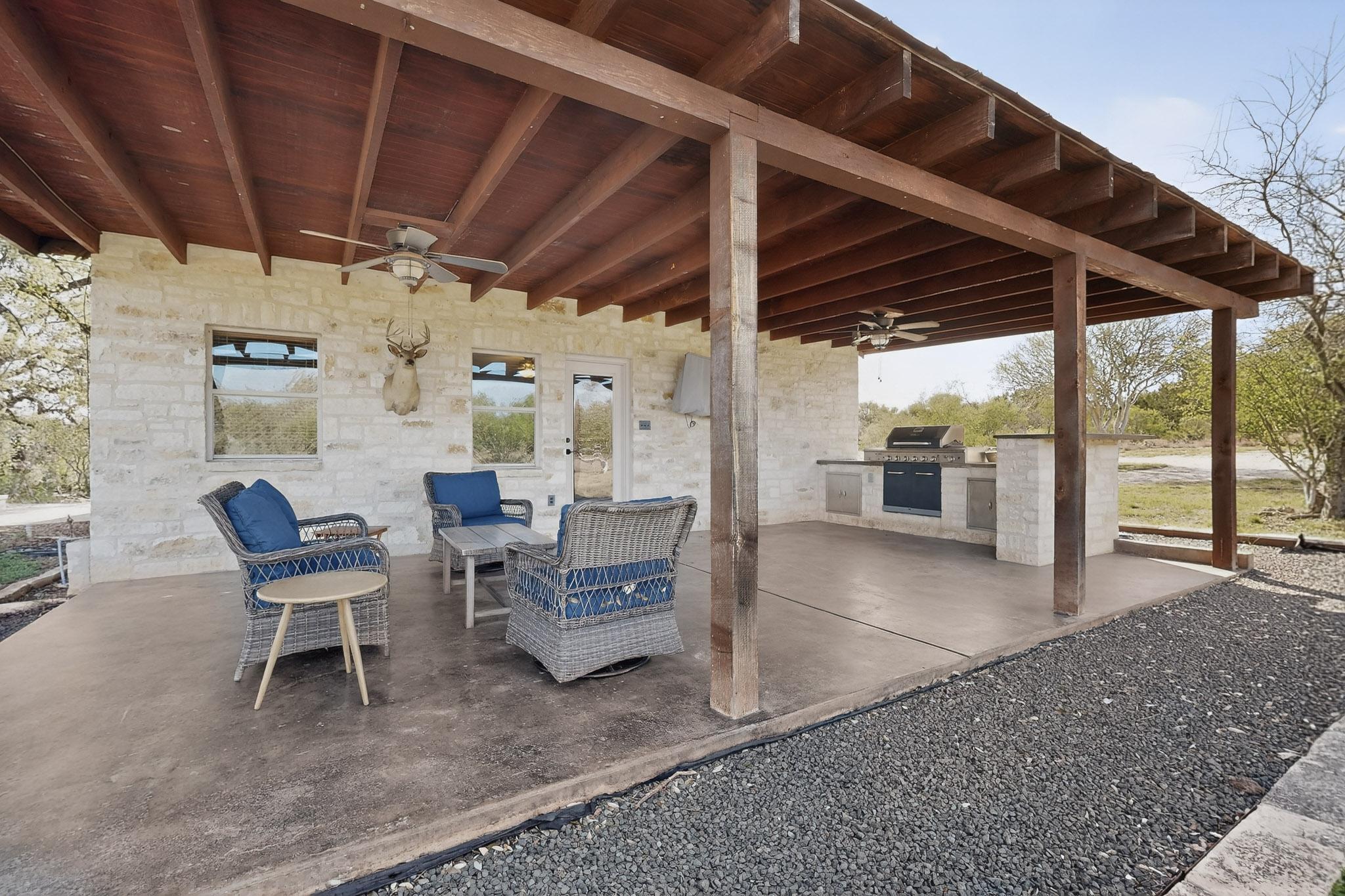 1619 Althaus Ranch Road Johnson City, TX 78636 - Photo 30 of 40 a outdoor space with a couch and chairs