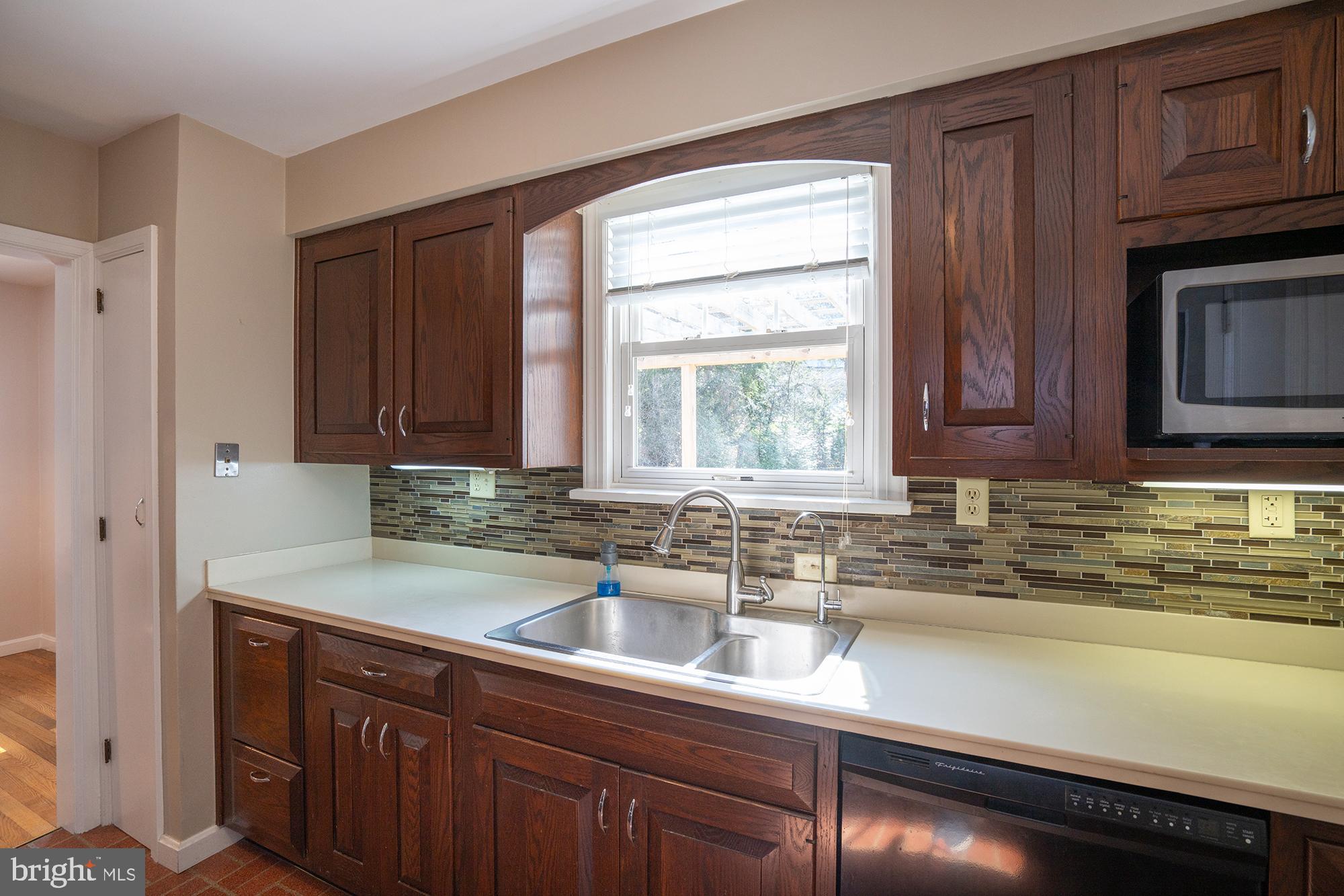 422 Martin Terrace State College, PA 16803 - Photo 11 of 56 a kitchen with stainless steel appliances granite countertop a sink a stove and cabinets