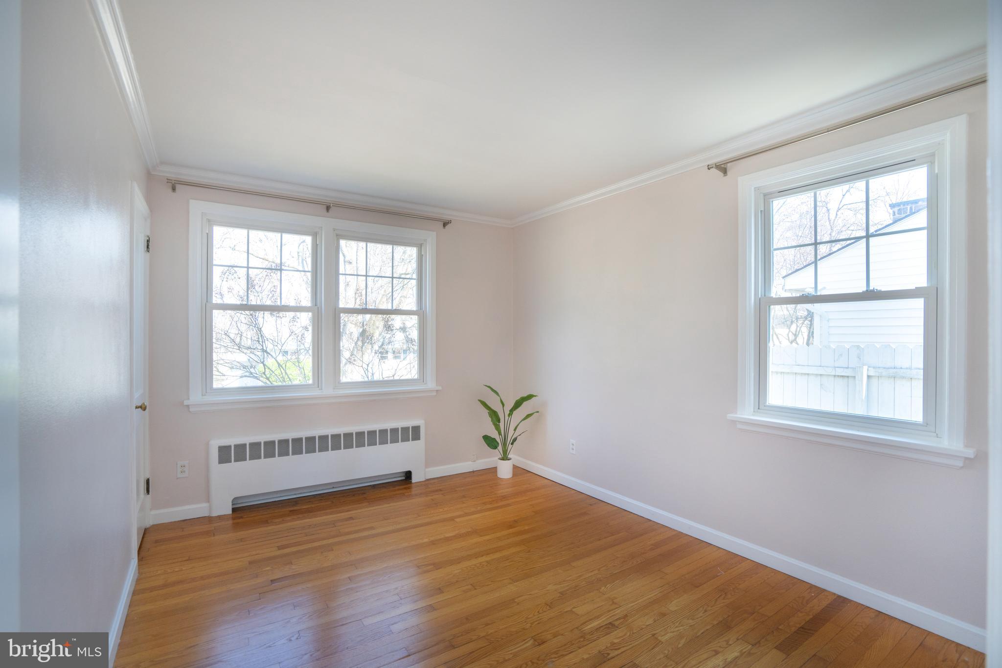 422 Martin Terrace State College, PA 16803 - Photo 12 of 56 an empty room with wooden floor and windows