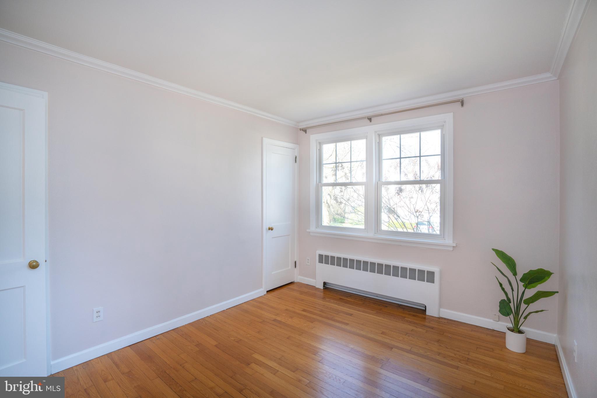 422 Martin Terrace State College, PA 16803 - Photo 13 of 56 an empty room with wooden floor and windows