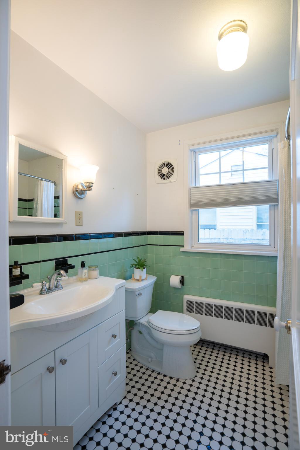 422 Martin Terrace State College, PA 16803 - Photo 18 of 56 a bathroom with a double vanity sink and a mirror