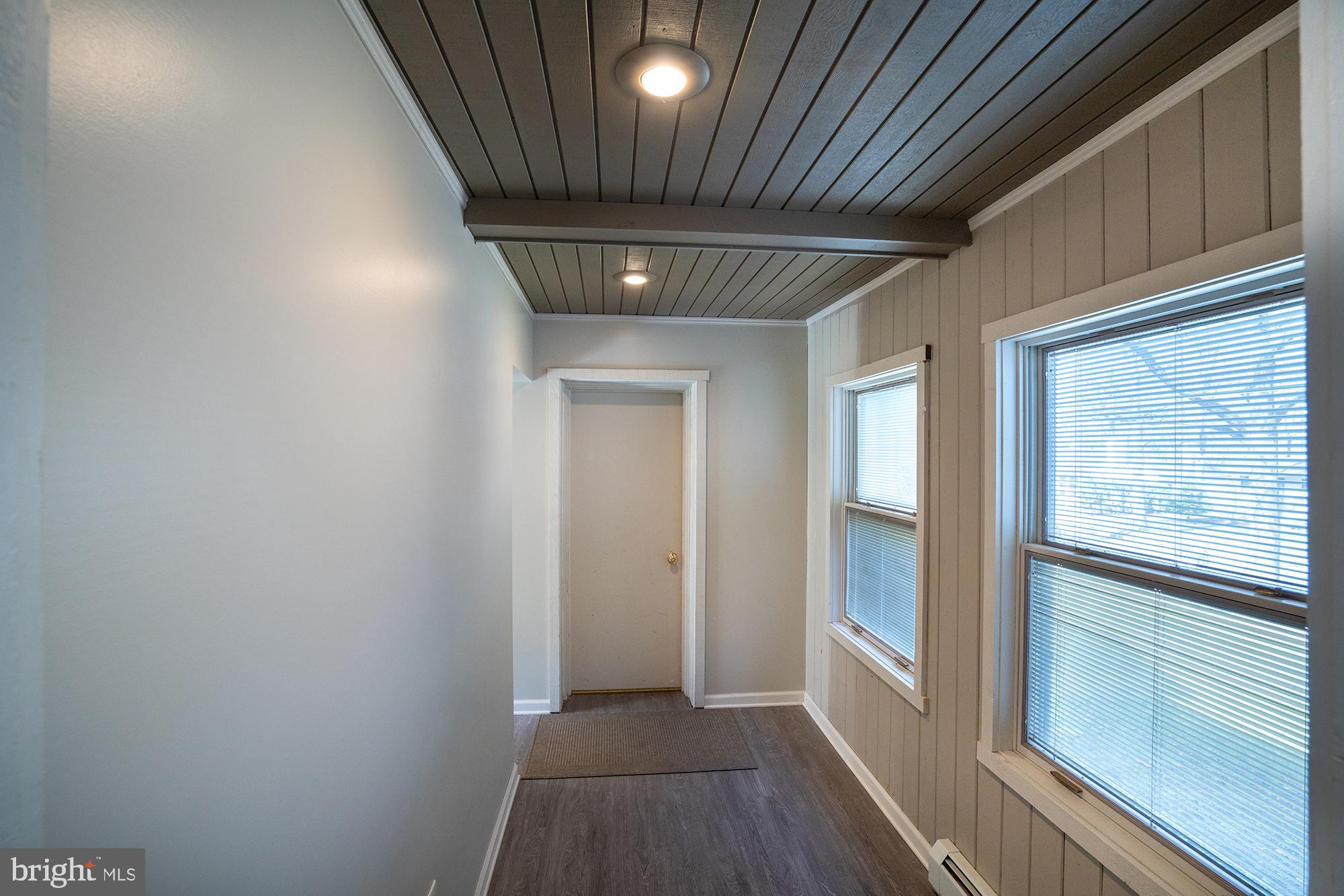 422 Martin Terrace State College, PA 16803 - Photo 21 of 56 a hallway with wooden floor chandelier and entryway