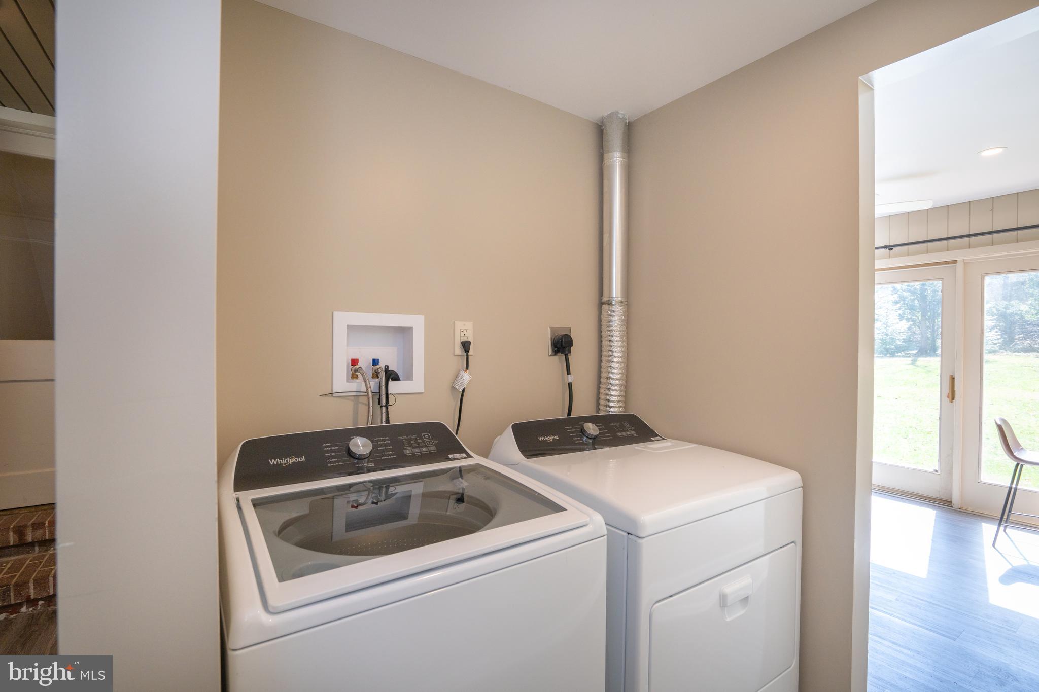 422 Martin Terrace State College, PA 16803 - Photo 23 of 56 a view of washer and dryer with bathroom in the background