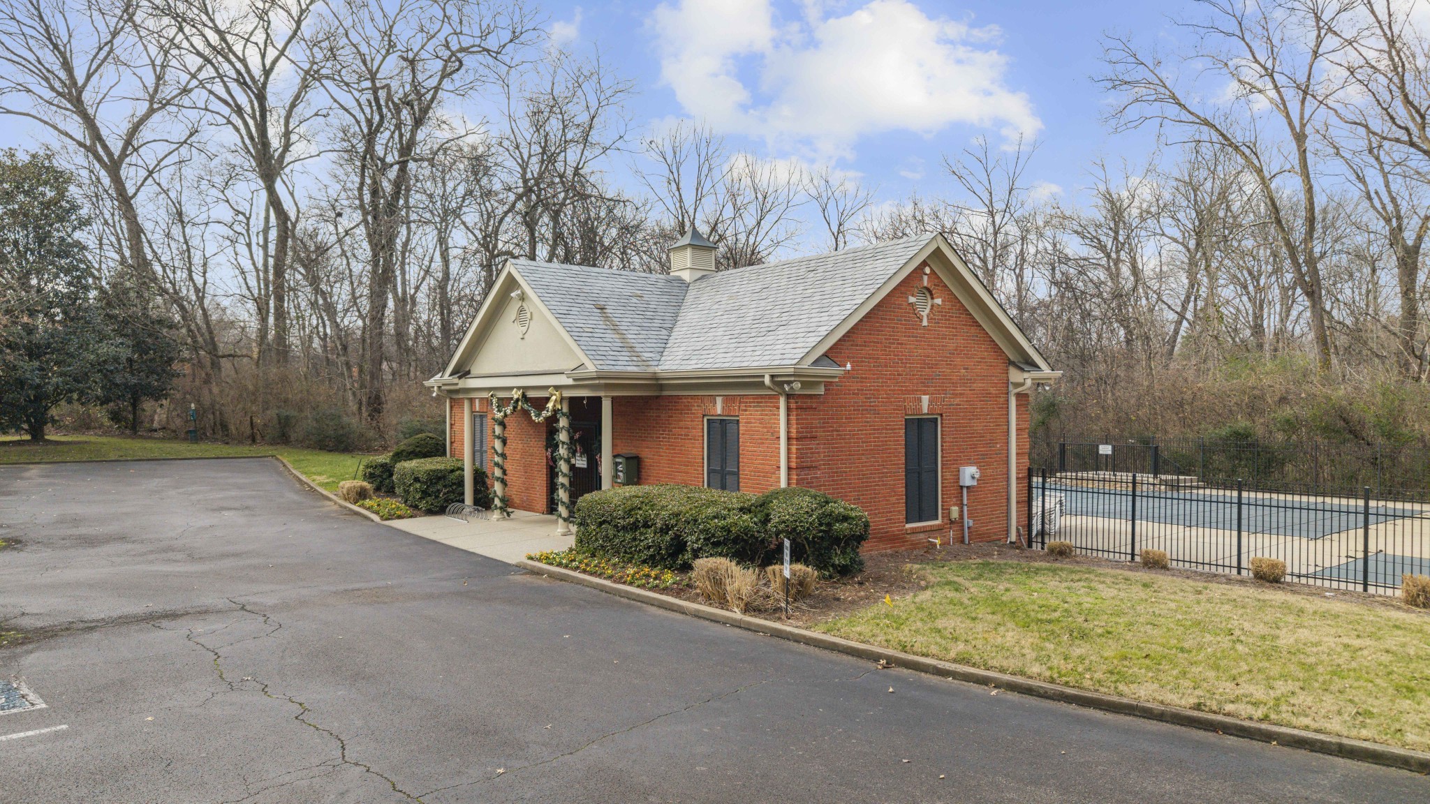 107 Tiffany Court Franklin, TN 37064 - Photo 97 of 98 a front view of a house with a yard and garage