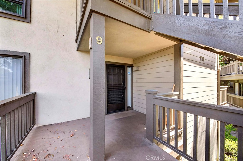 9 Madrona Irvine, CA 92612 - Photo 29 of 38 a view of a porch with a table and chair