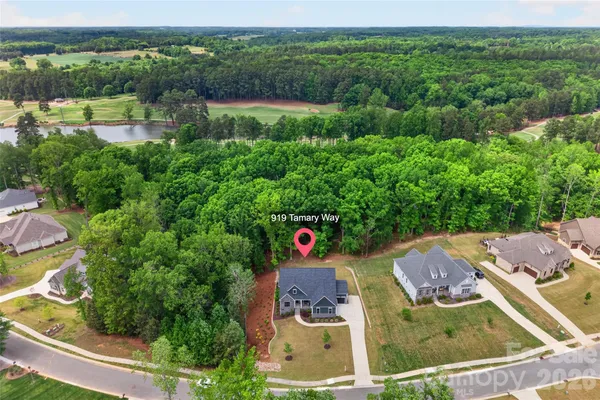 an aerial view of residential houses and outdoor space